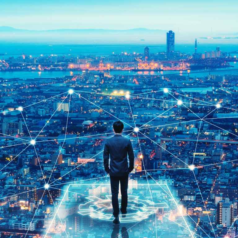 Business professional overlooking a futuristic smart city with glowing digital network connections, symbolizing data connectivity, technology, and innovation in urban infrastructure.