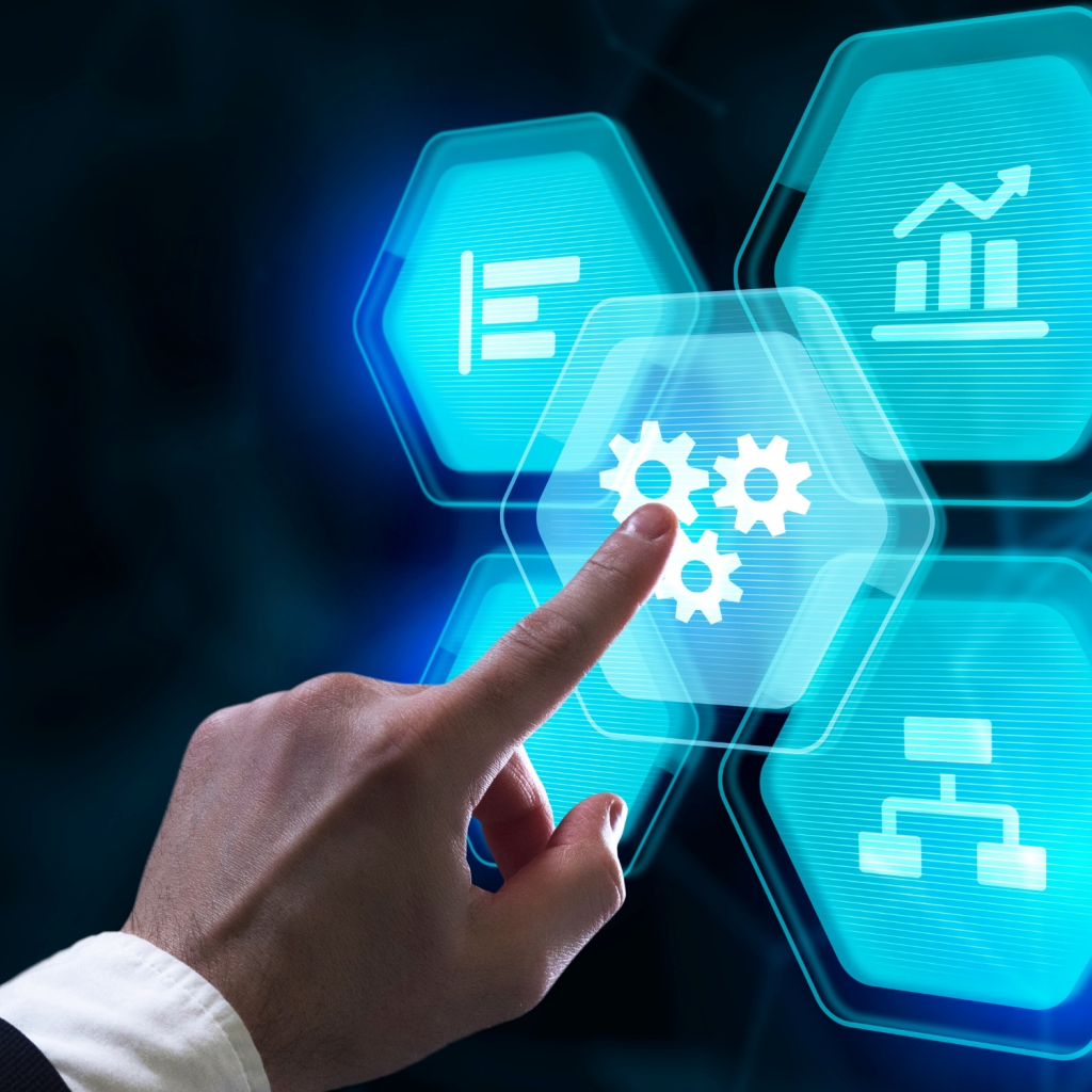 A business professional interacts with a digital touchscreen interface showing blue technology icons for automation, analytics, and workflow optimization — symbolizing digital transformation and process automation.