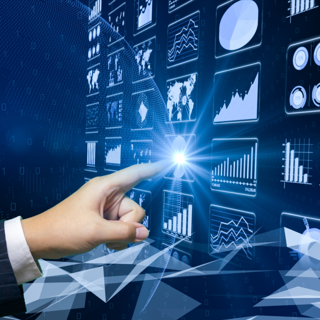 A close-up of a professional hand interacting with a virtual data dashboard, showcasing various graphs, charts, and data visualizations. The blue, futuristic design emphasizes the use of data analytics and digital transformation. This image highlights the integration of advanced technologies in business decision-making, with real-time data being accessed and manipulated through intuitive touch interfaces. Ideal for content related to big data, analytics, AI-driven insights, and business intelligence.