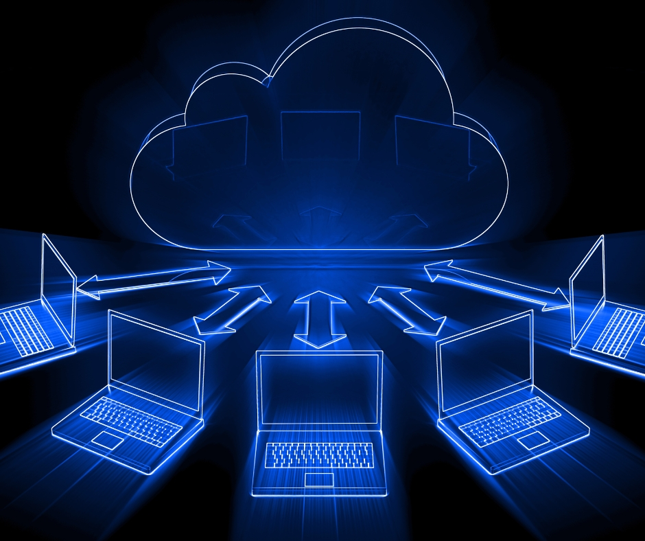 A glowing blue cloud computing illustration showing multiple laptops connected to a central cloud, representing data synchronisation, cloud storage, and enterprise digital collaboration.