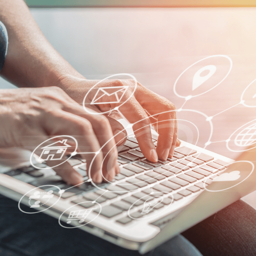 Hands typing on a laptop with connected digital icons representing email, location, web, and customer engagement.